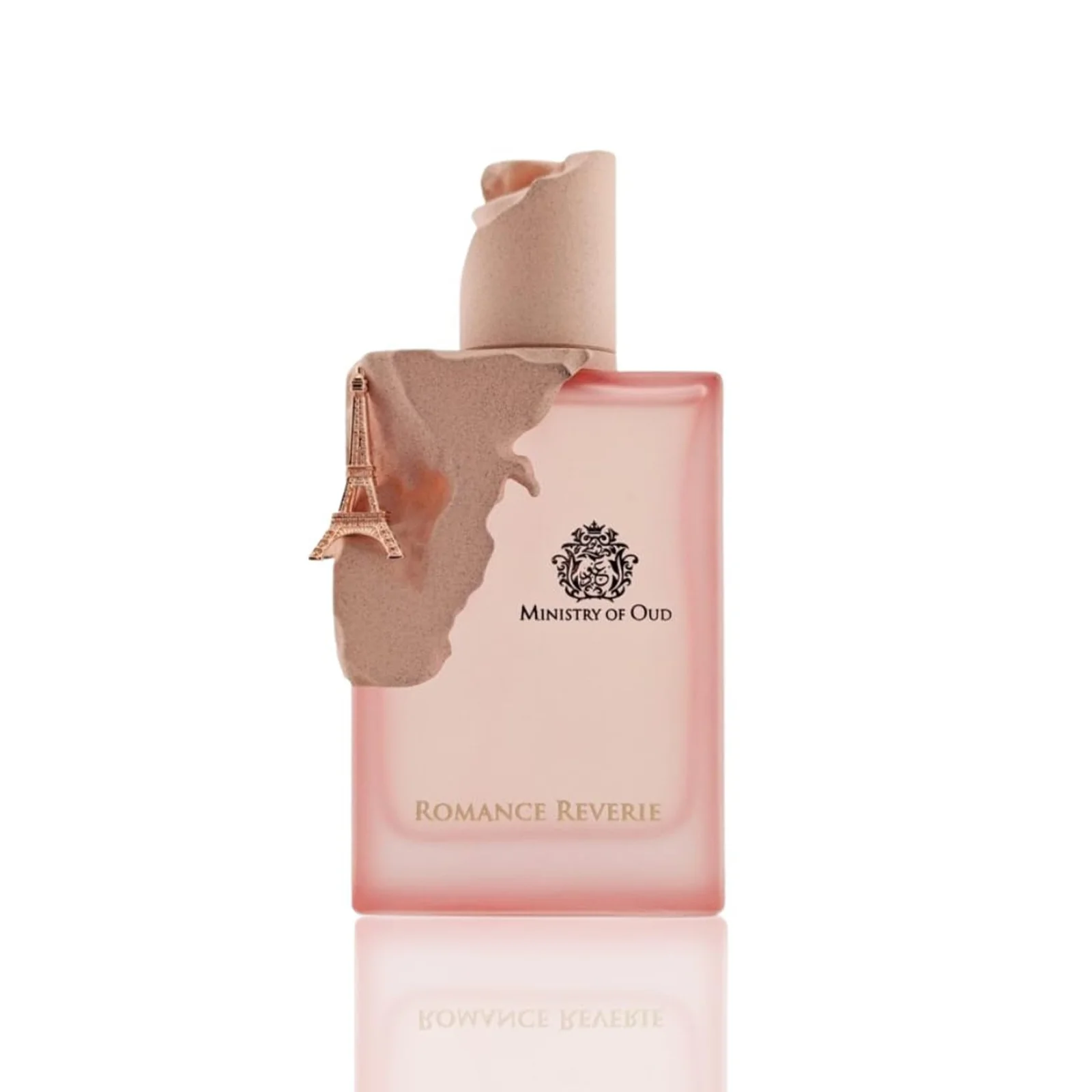 Ministry of Oud Romance Reverie edp 100ml Ministry of Oud Romance Reverie perfume bottle with a clear glass body, soft pink fragrance liquid, and a metallic cap, presented in a minimalist luxury style.